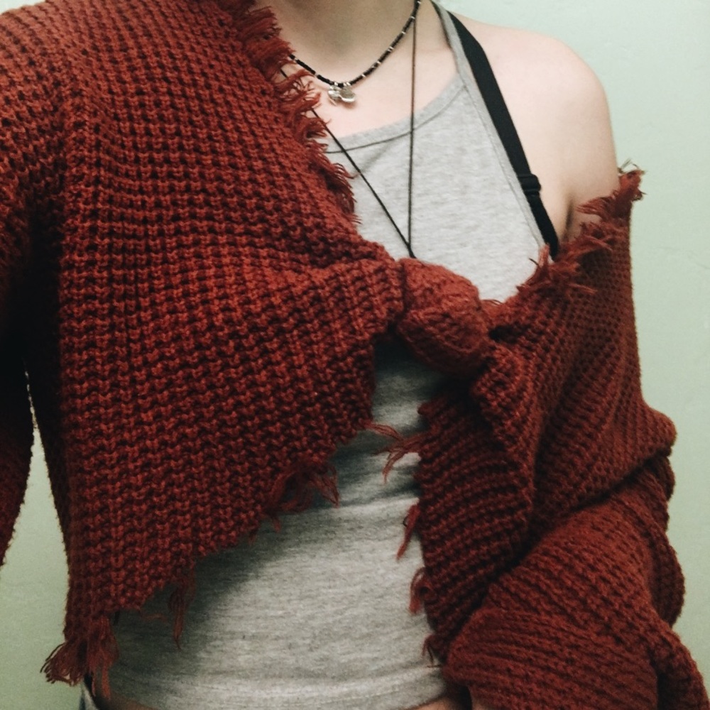 Super cute burnt orange knit and fringed sweater